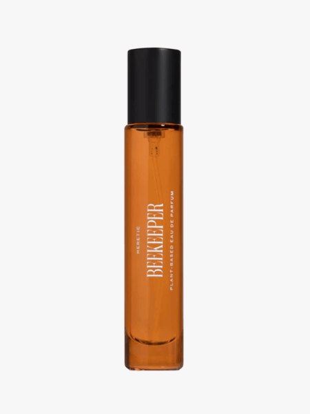A vial of heretic Beekeeper Eau de Parfum on a light gray background